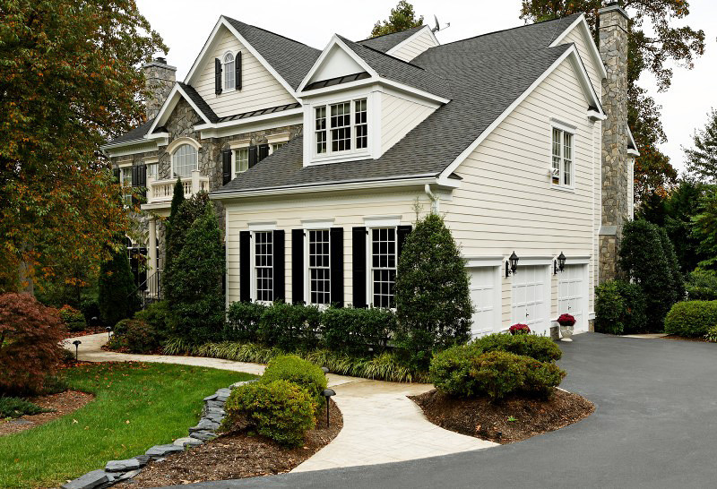 Example of a large classic gray two-story mixed siding gable roof design in DC Metro