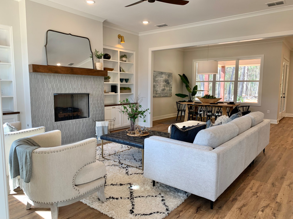 Design ideas for a small transitional living room in Other with white walls, vinyl floors and a tile fireplace surround.