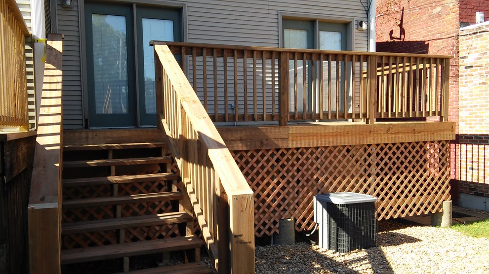 Design ideas for a small traditional backyard deck in St Louis with no cover.