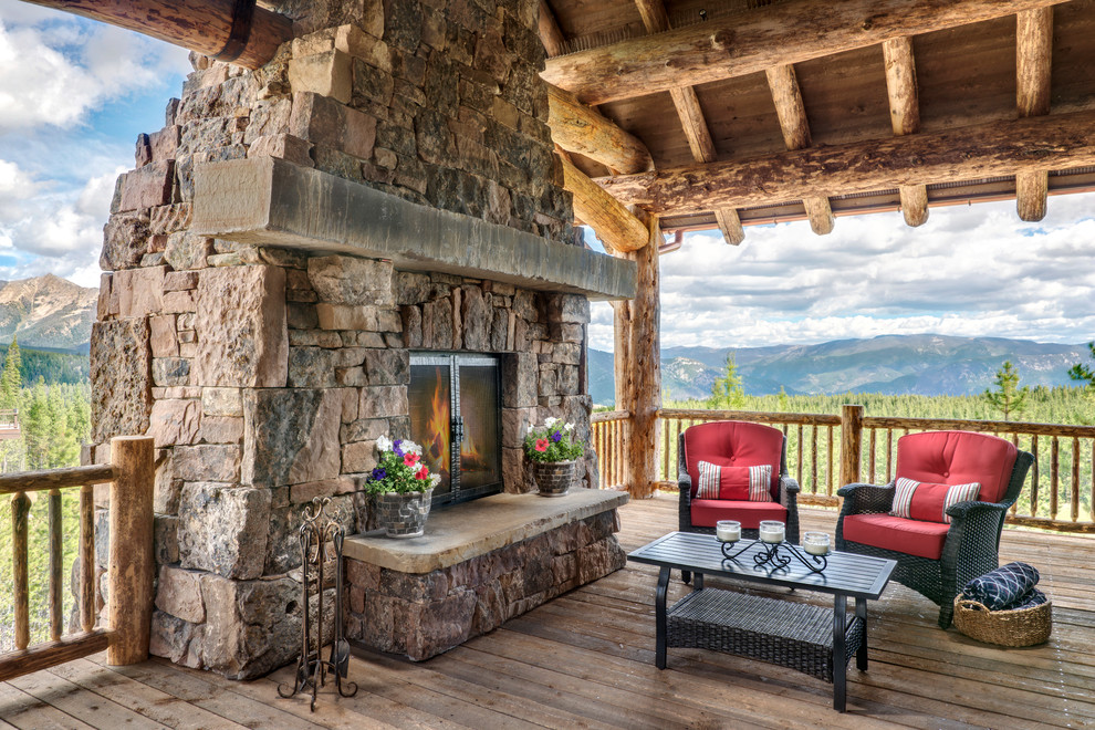 Example of a mountain style deck design with a roof extension