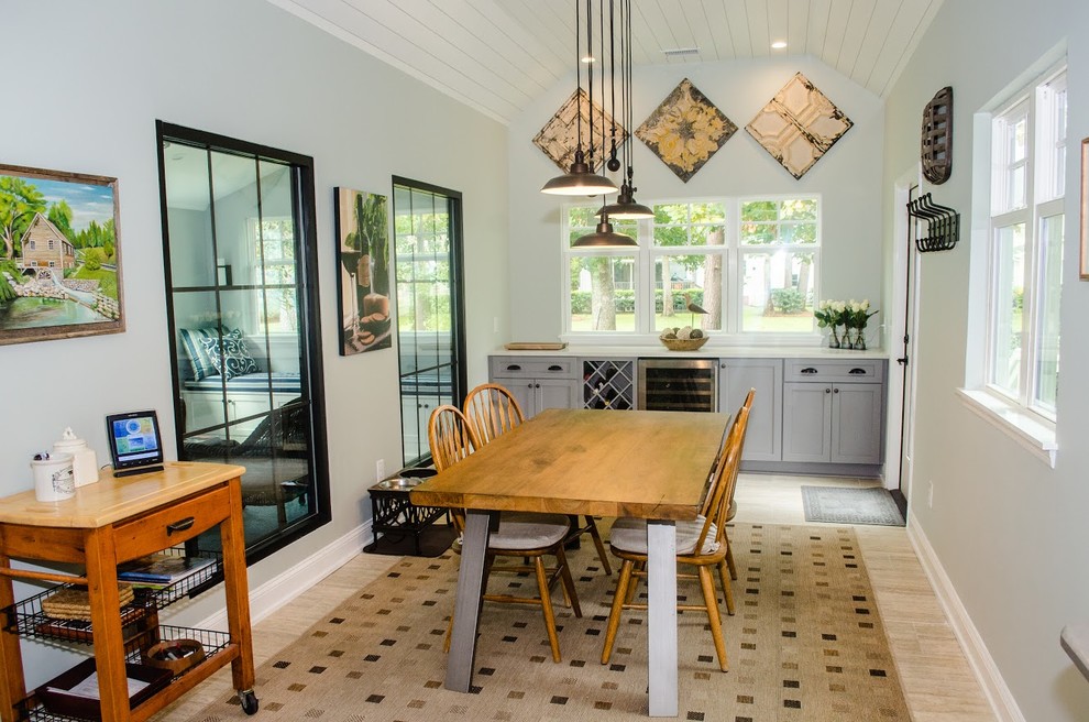 Mid-sized country separate dining room in Charleston with white walls, light hardwood floors and beige floor.