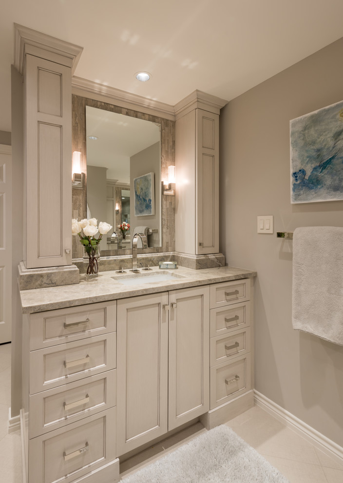Design ideas for a mid-sized transitional master bathroom in Dallas with shaker cabinets, grey cabinets, a double shower, a two-piece toilet, gray tile, mosaic tile, grey walls, porcelain floors, an undermount sink, quartzite benchtops and a hinged shower door.