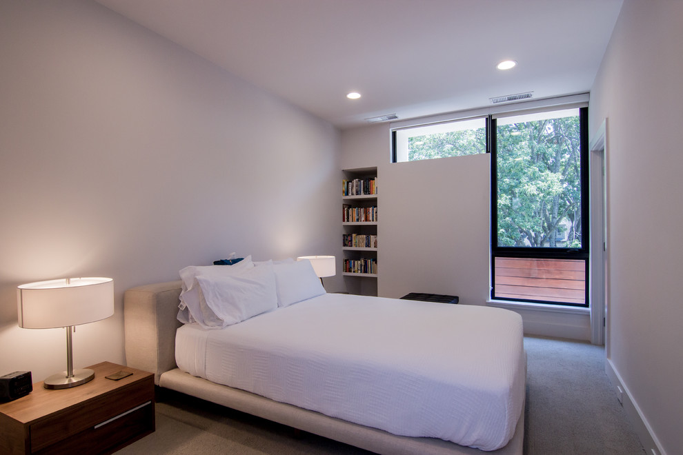 This is an example of a small midcentury guest bedroom in Dallas with white walls, porcelain floors and beige floor.