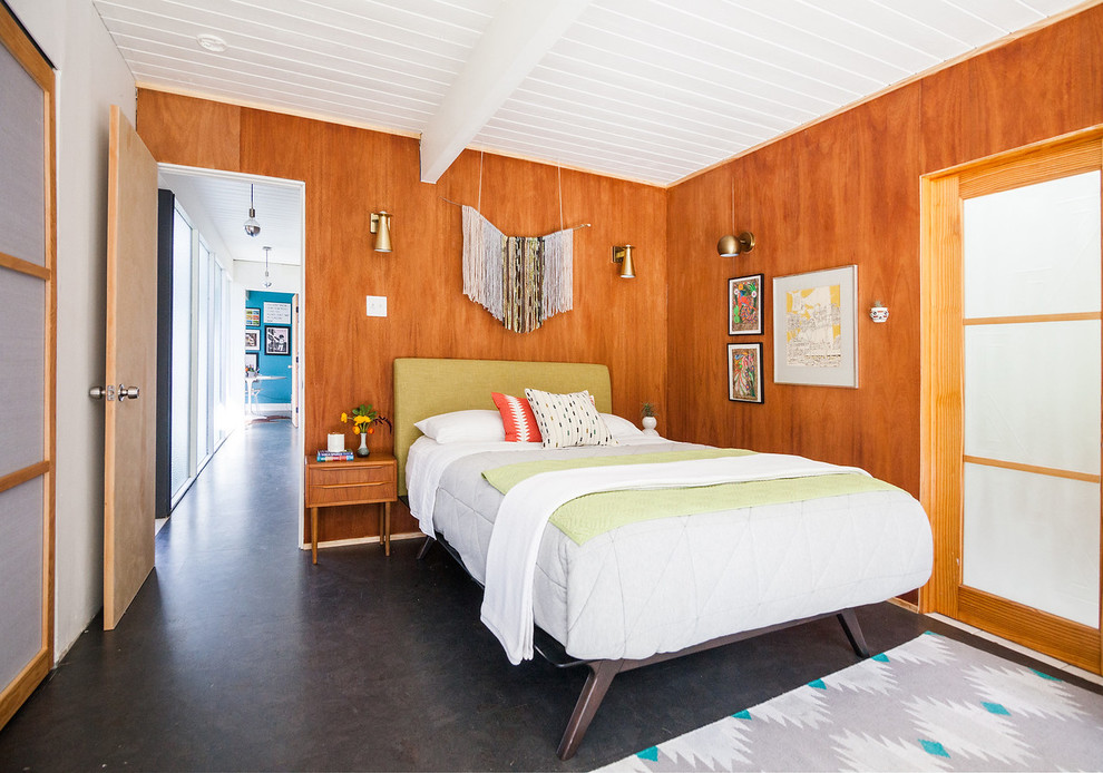 Small midcentury master bedroom in San Francisco with cork floors and brown floor.