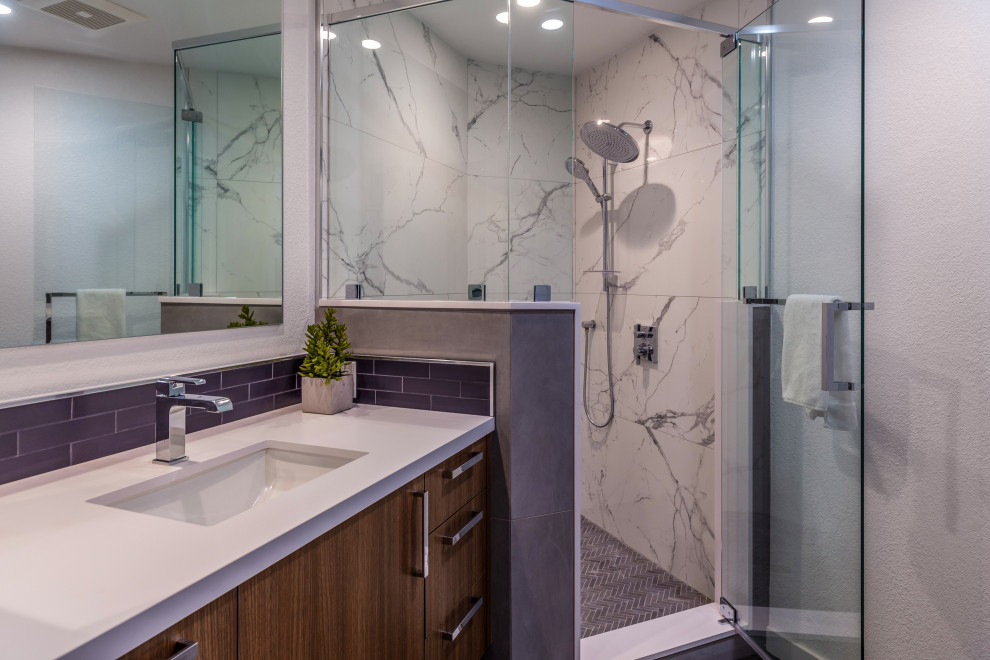 This is an example of a mid-sized transitional master bathroom in San Francisco with shaker cabinets, brown cabinets, a freestanding tub, a double shower, a bidet, white tile, porcelain tile, white walls, vinyl floors, an undermount sink, quartzite benchtops, brown floor, a hinged shower door, white benchtops, a niche, a double vanity, a built-in vanity and vaulted.