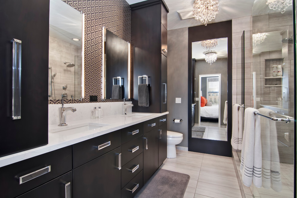 This is an example of a contemporary master bathroom in Minneapolis with an undermount sink, flat-panel cabinets, dark wood cabinets, an open shower, gray tile, grey walls and an open shower.