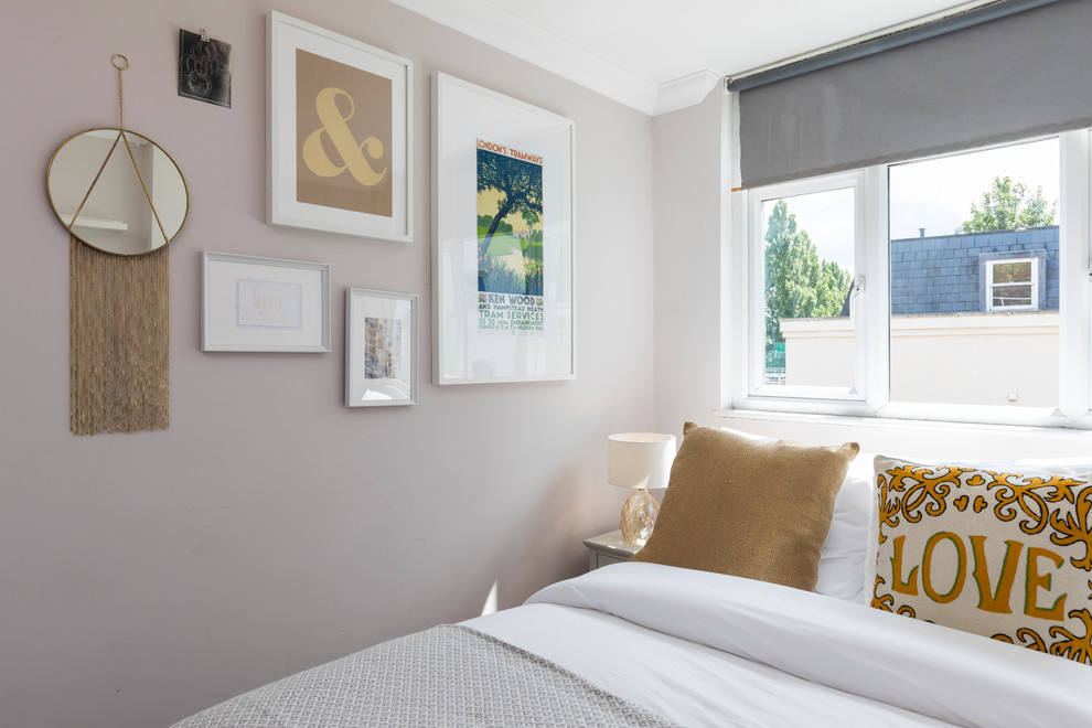 Inspiration for a mid-sized modern guest bedroom in London with beige walls, carpet and grey floor.