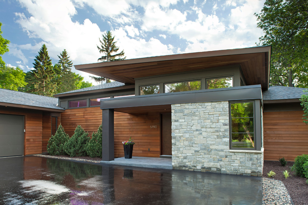 This is an example of a contemporary exterior in Minneapolis with wood siding.