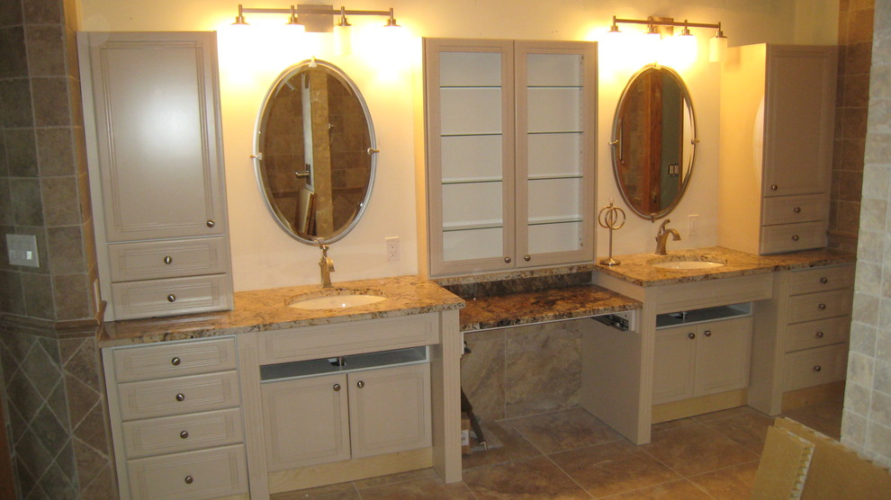 Mid-sized arts and crafts master bathroom in Calgary with raised-panel cabinets, white cabinets, beige walls, ceramic floors, an undermount sink, granite benchtops and beige floor.