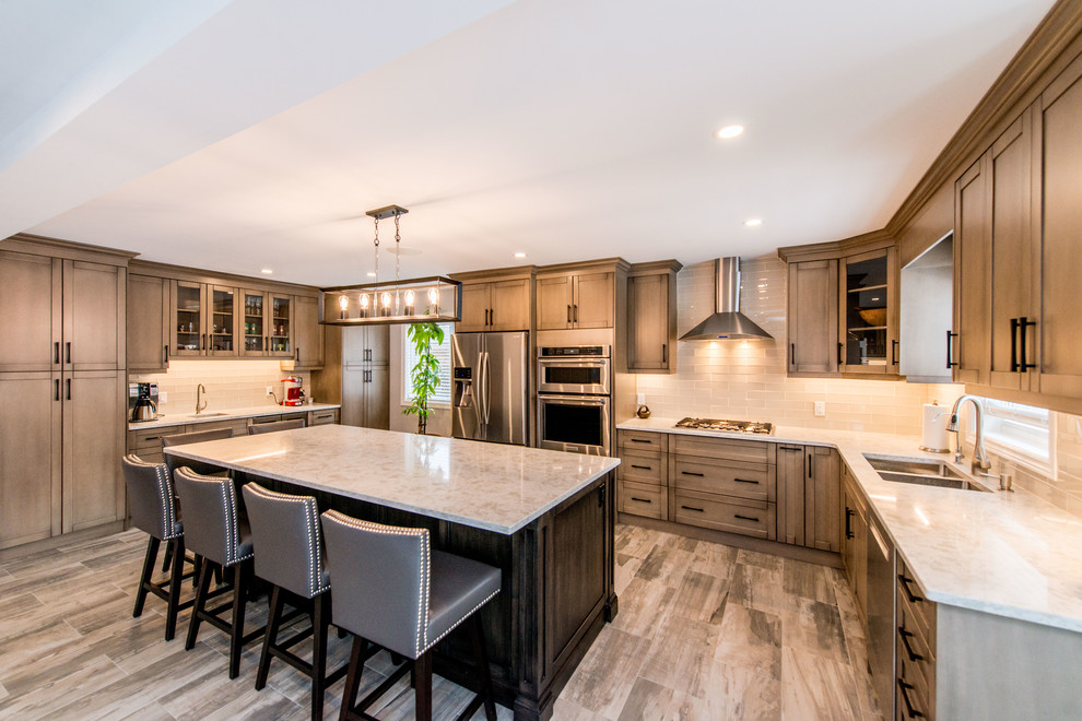 Example of a transitional kitchen design in Toronto