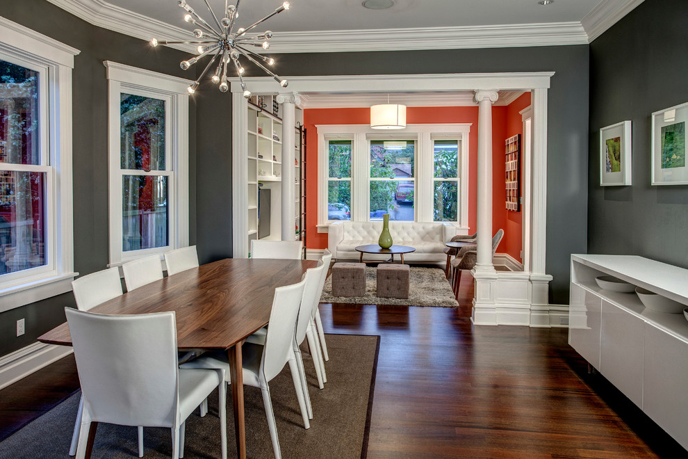 Design ideas for a mid-sized transitional dining room in Seattle with grey walls and dark hardwood floors.