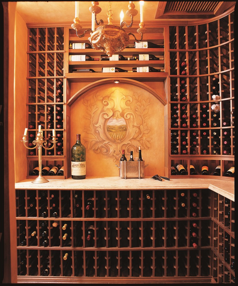 Large traditional wine cellar in Orange County with terra-cotta floors and display racks.