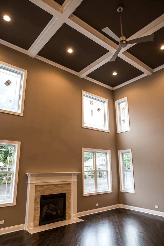 Example of a huge transitional formal and open concept dark wood floor home design design in Chicago with brown walls, a standard fireplace, a stone fireplace and no tv