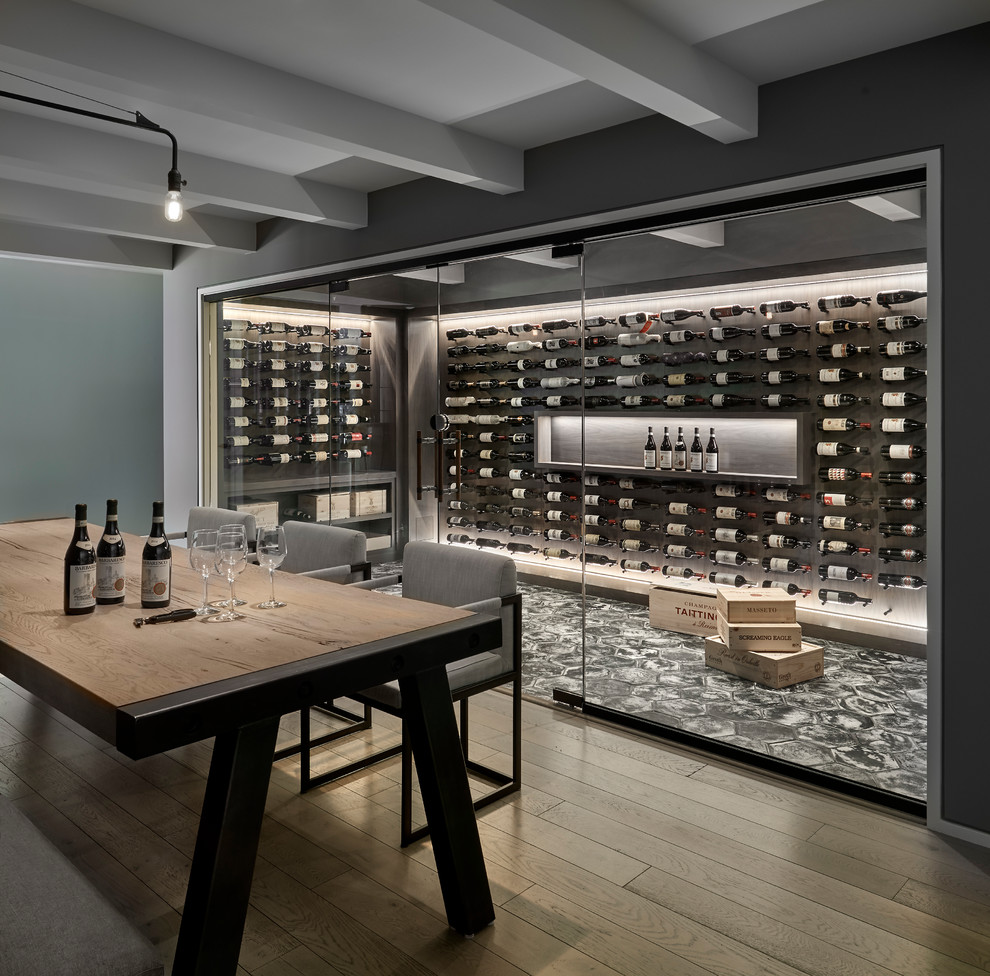 Inspiration for a contemporary wine cellar in Chicago with display racks and grey floor.