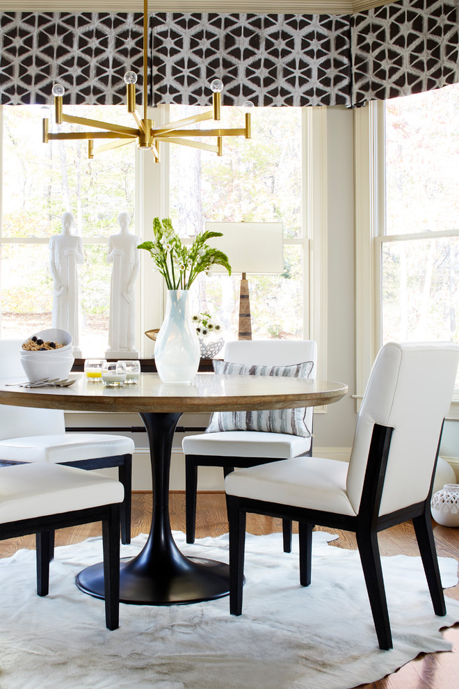 Design ideas for a transitional kitchen/dining combo in Atlanta with grey walls and medium hardwood floors.