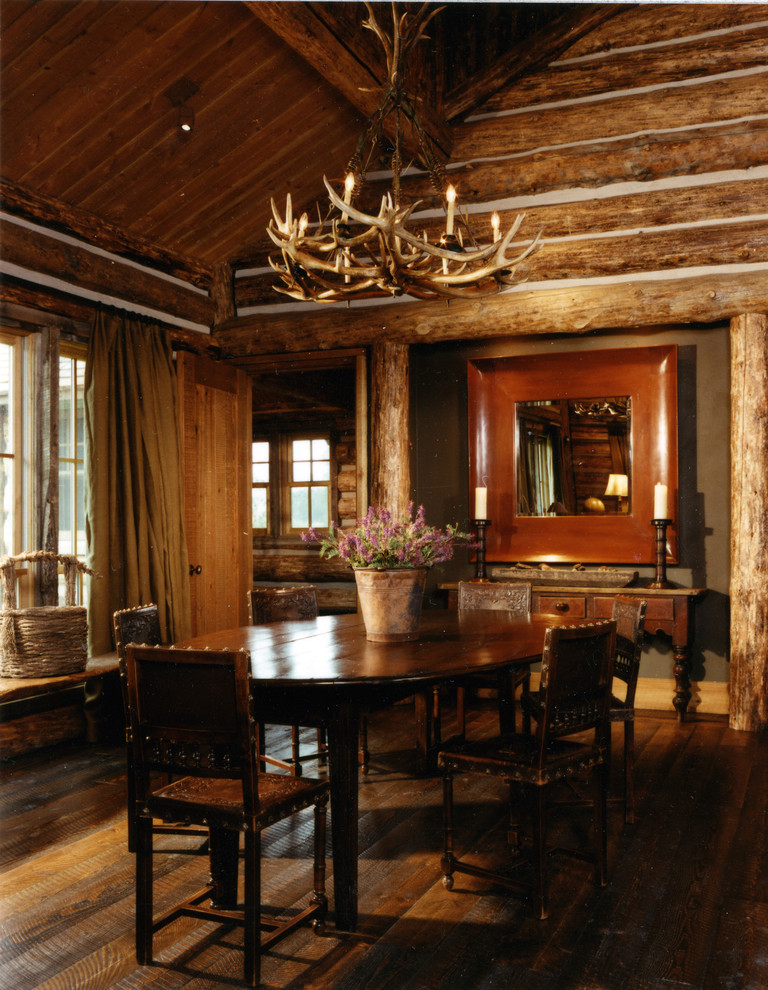 Dining room - rustic dark wood floor dining room idea