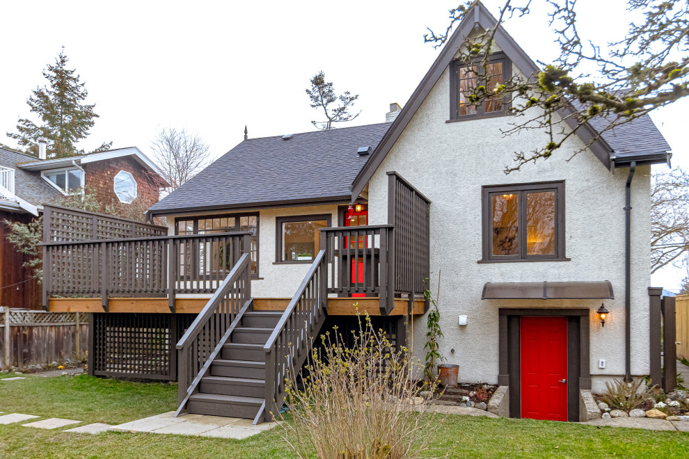 Inspiration for a mid-sized transitional backyard second story privacy and wood railing deck remodel