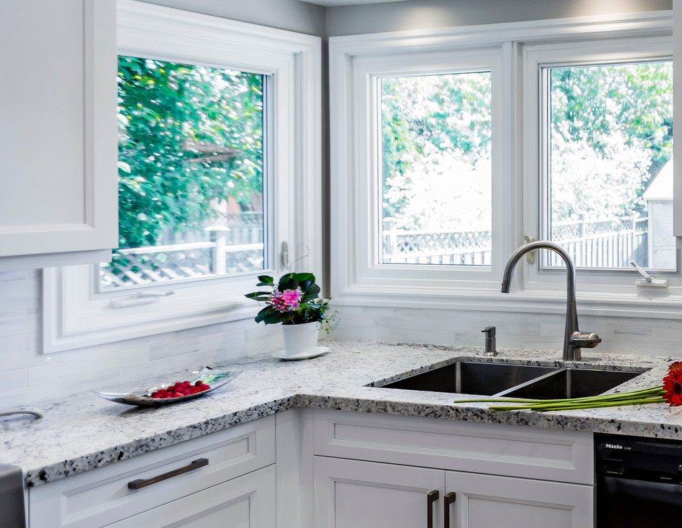 Example of a transitional kitchen design in Toronto