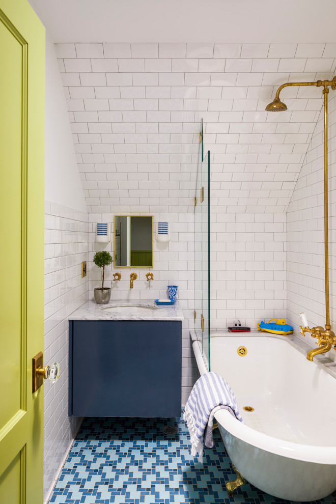 Larchmont Victorian - A tiny boys' bath on the attic level of our Larchmont Victorian project. The room has no windows so we installed a small skylight to let natural light into the room. The floor is in American Restoration Tile.