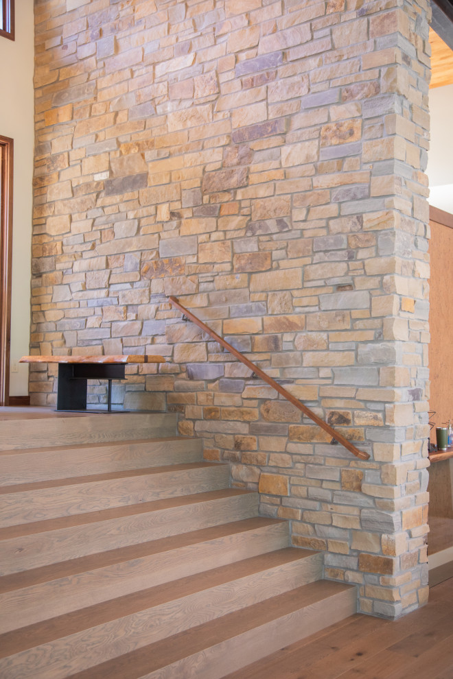 Staircase - large transitional medium tone wood floor and brown floor staircase idea with white walls and a medium wood front door
