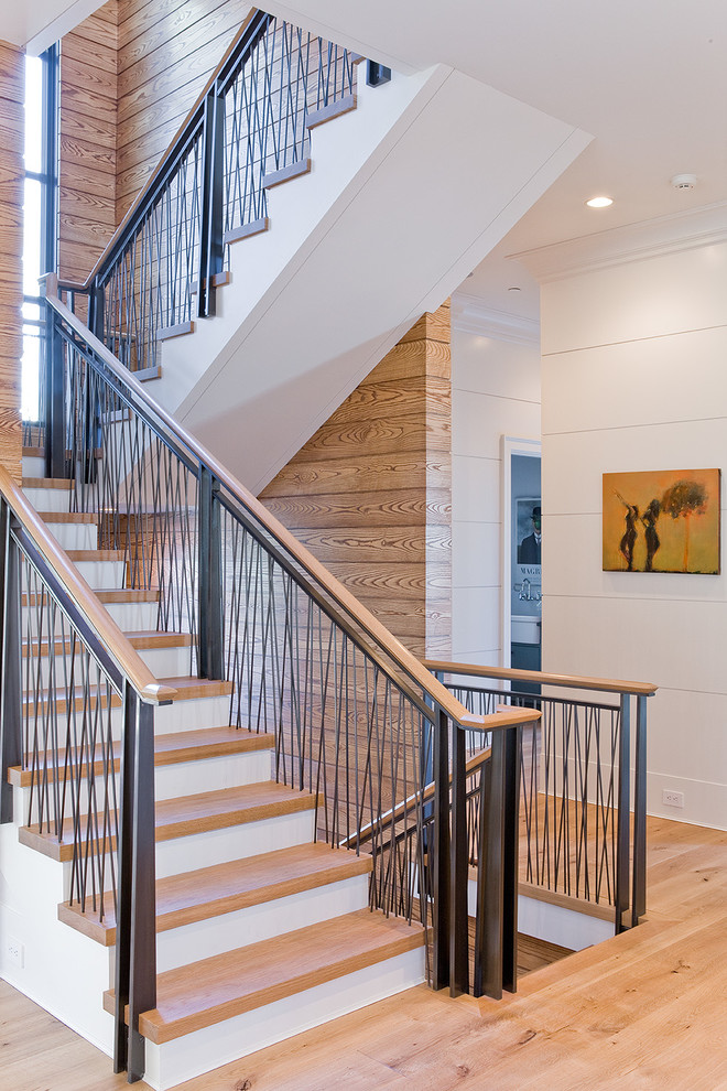 Design ideas for a transitional wood u-shaped staircase in Boston with painted wood risers.
