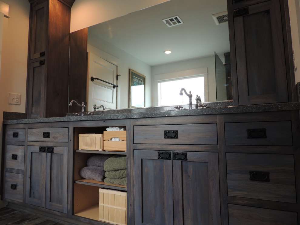 Mid-sized country master bathroom in Portland with shaker cabinets, dark wood cabinets, a corner shower, white walls, vinyl floors, an integrated sink, solid surface benchtops, brown floor, an open shower, grey benchtops, a shower seat, a double vanity and a built-in vanity.