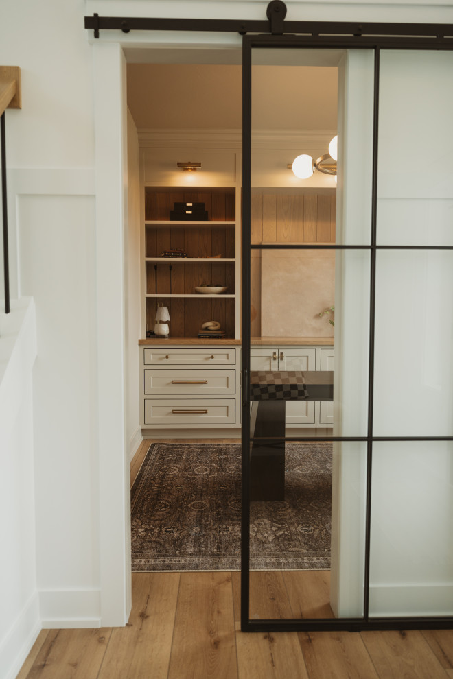 Transitional gender-neutral closet photo in Grand Rapids