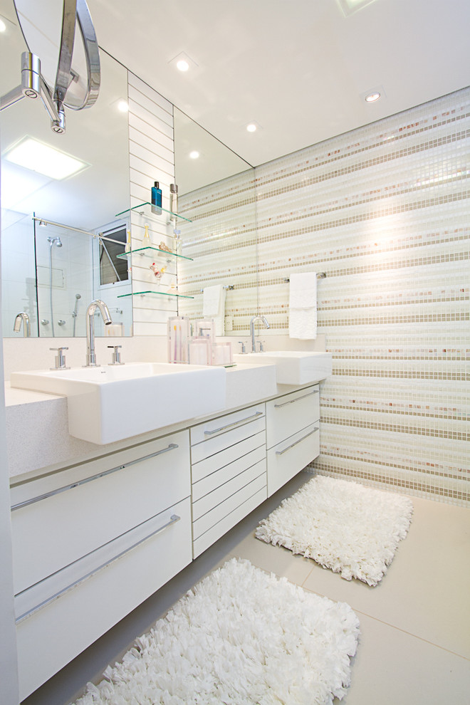 This is an example of a contemporary bathroom in Other with a drop-in sink and multi-coloured tile.