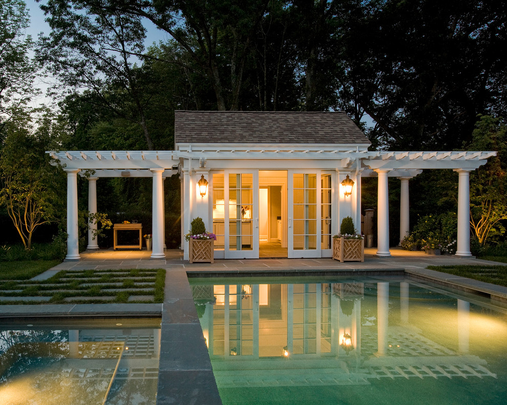 Traditional rectangular pool in Boston with a pool house.