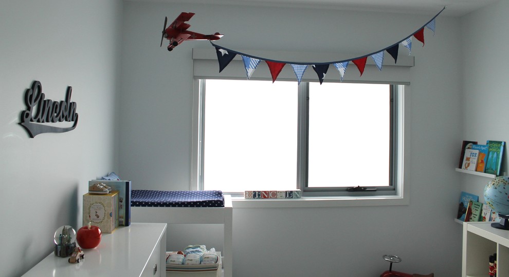 Design ideas for a mid-sized contemporary kids' room for boys in Melbourne with white walls and carpet.