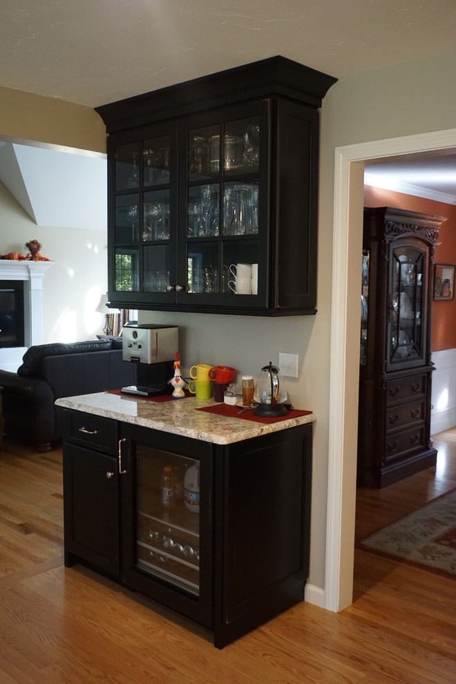 Large elegant l-shaped eat-in kitchen photo in Boston with a farmhouse sink, raised-panel cabinets, white cabinets, quartz countertops, white backsplash, ceramic backsplash, stainless steel appliances and an island