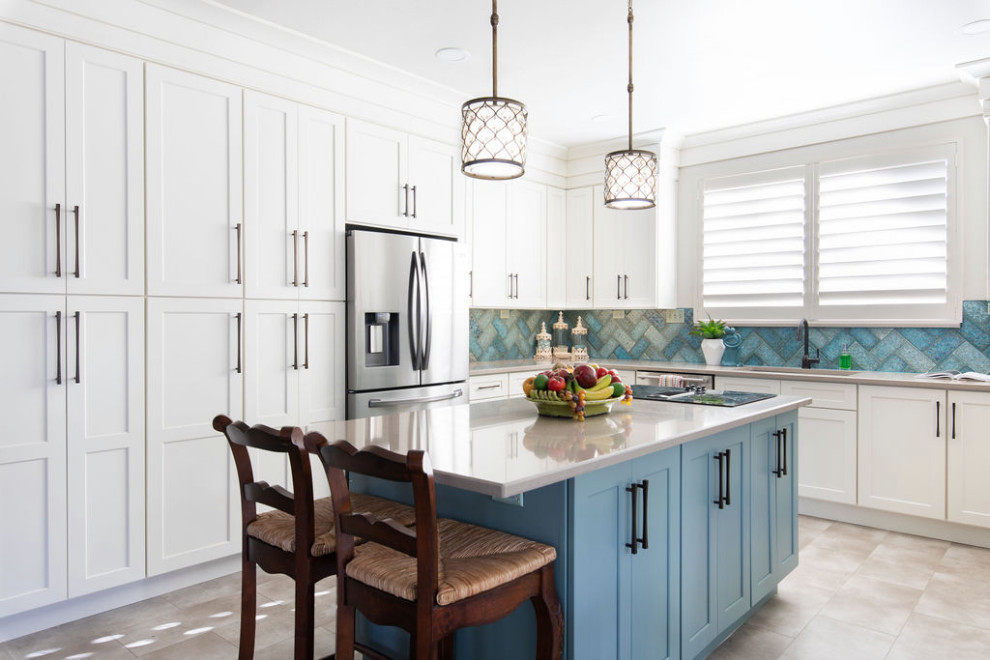 Barker Ridge Drive - Inspiration for an eclectic u-shaped kitchen remodel in Austin with an undermount sink, quartzite countertops, ceramic backsplash, stainless steel appliances and an island