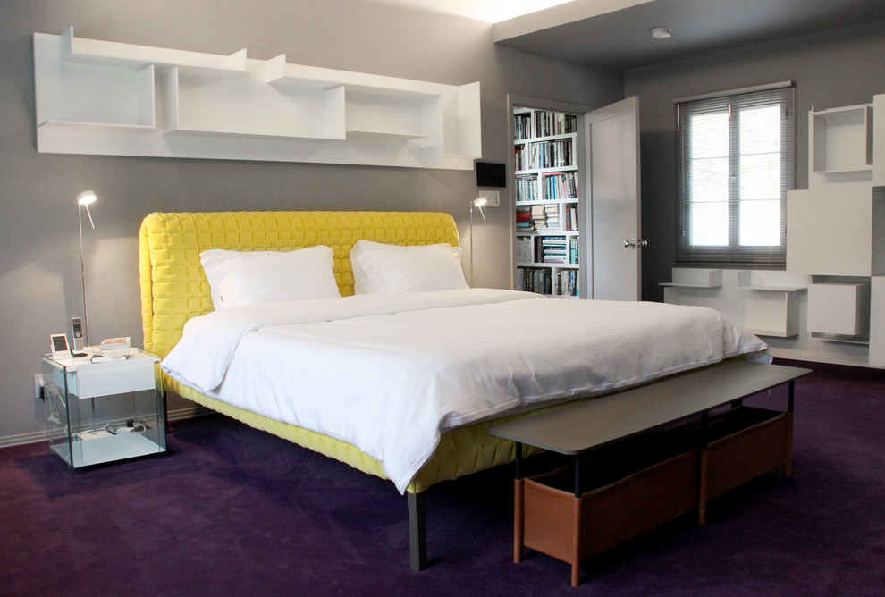 This is an example of a mid-sized modern master bedroom in Los Angeles with grey walls, carpet and purple floor.