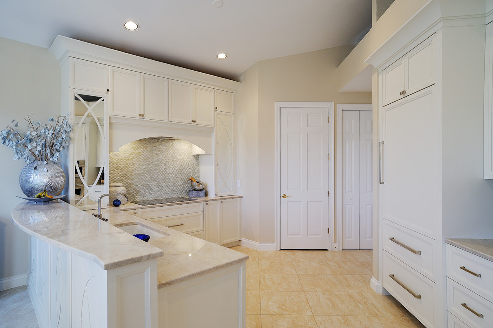 Eat-in kitchen - mid-sized transitional l-shaped eat-in kitchen idea in Miami with a double-bowl sink, recessed-panel cabinets, white cabinets, quartzite countertops, white backsplash, glass tile backsplash, paneled appliances and a peninsula