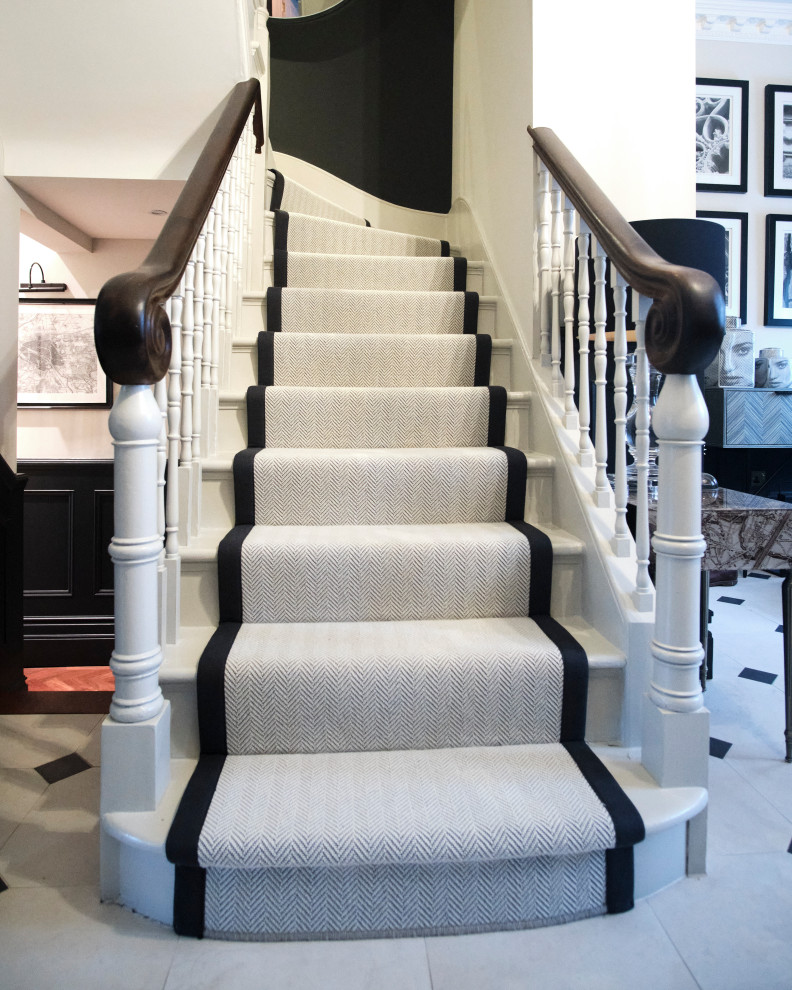 Photo of a medium sized classic wood straight wood railing staircase in London with wood risers.