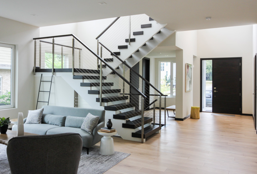 Inspiration for a large contemporary wood u-shaped staircase in DC Metro with mixed railing.