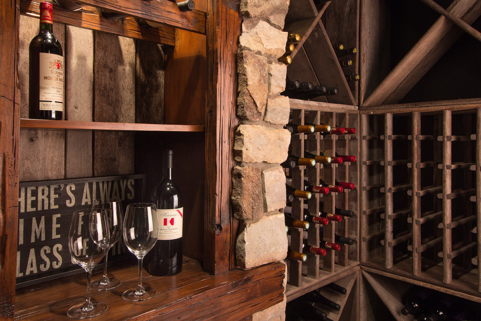 Inspiration for a large transitional wine cellar in Detroit with brick floors and storage racks.