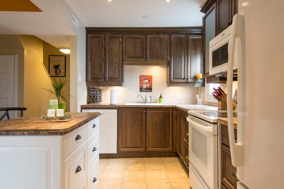 Example of a transitional l-shaped ceramic tile eat-in kitchen design in Toronto with a double-bowl sink, recessed-panel cabinets, dark wood cabinets, laminate countertops, white appliances and an island