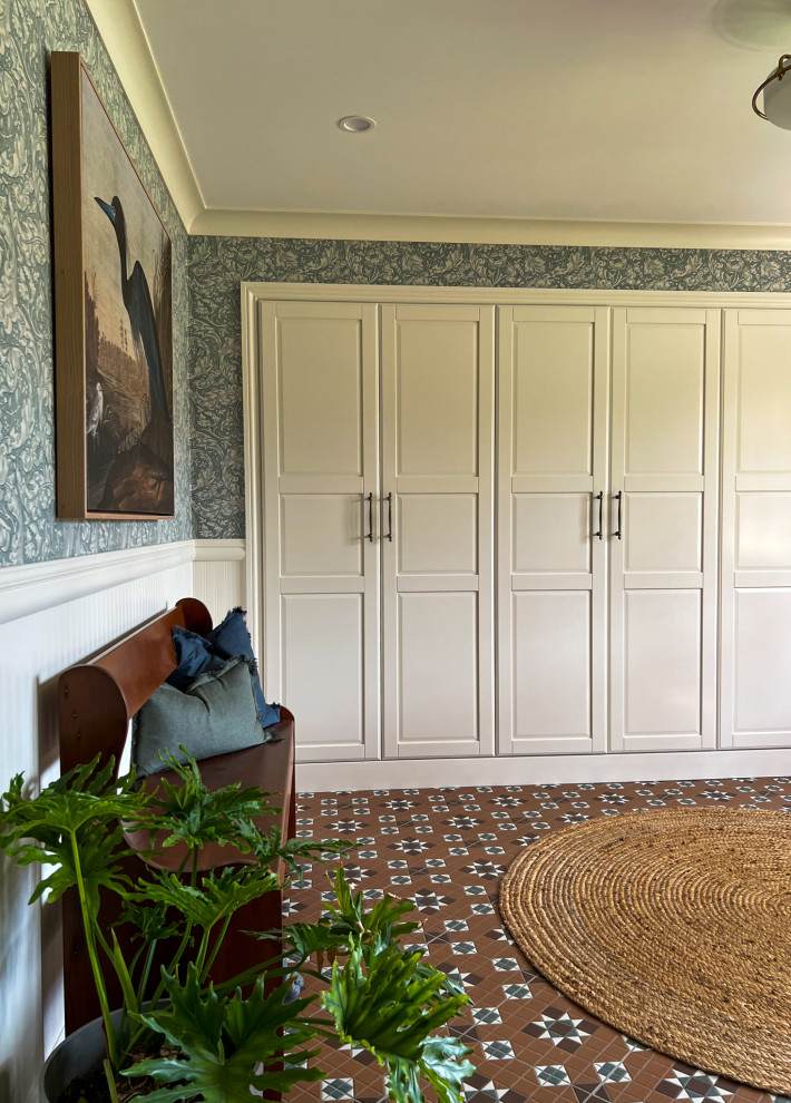 Mid-sized victorian front door in Brisbane with beige walls, ceramic floors, a double front door, a medium wood front door, orange floor and wallpaper.