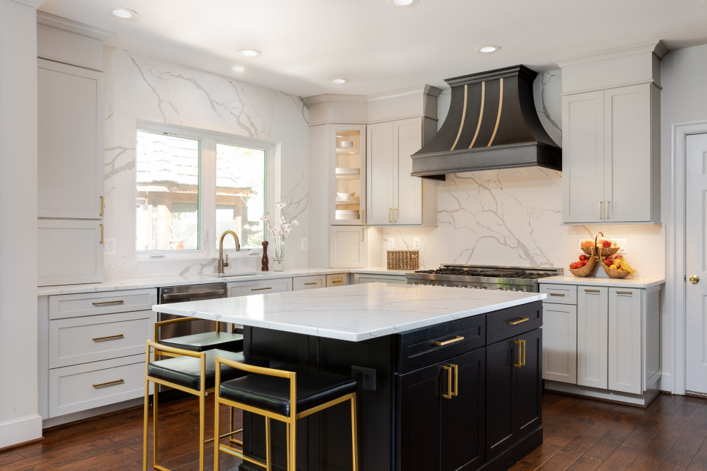 Modern l-shaped eat-in kitchen in DC Metro with a drop-in sink, flat-panel cabinets, white cabinets, quartzite benchtops, white splashback, engineered quartz splashback, stainless steel appliances, dark hardwood floors, with island, white benchtop and wood.