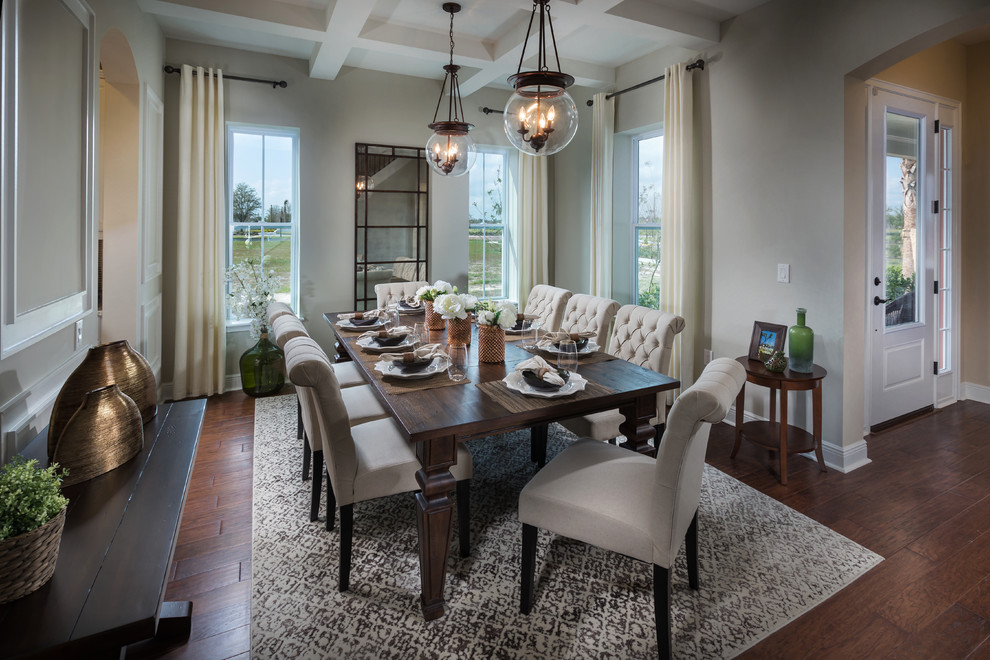 Inspiration for a mid-sized transitional dining room in Tampa with beige walls and medium hardwood floors.