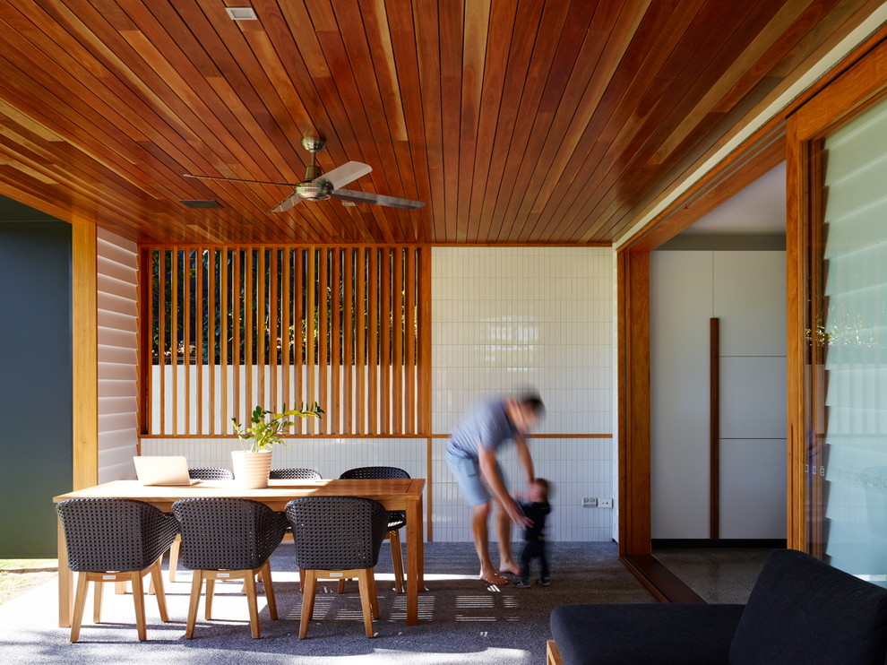 Inspiration for a contemporary patio in Brisbane with a roof extension.