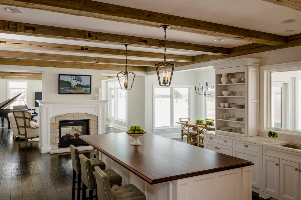 Open concept kitchen - large transitional l-shaped dark wood floor open concept kitchen idea in Chicago with an undermount sink, recessed-panel cabinets, white cabinets, quartz countertops, white backsplash, ceramic backsplash, stainless steel appliances and an island
