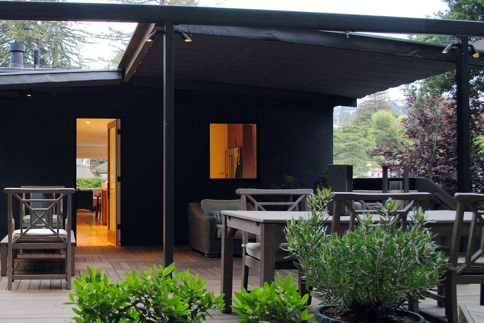 This is an example of a contemporary deck in San Francisco with a pergola.