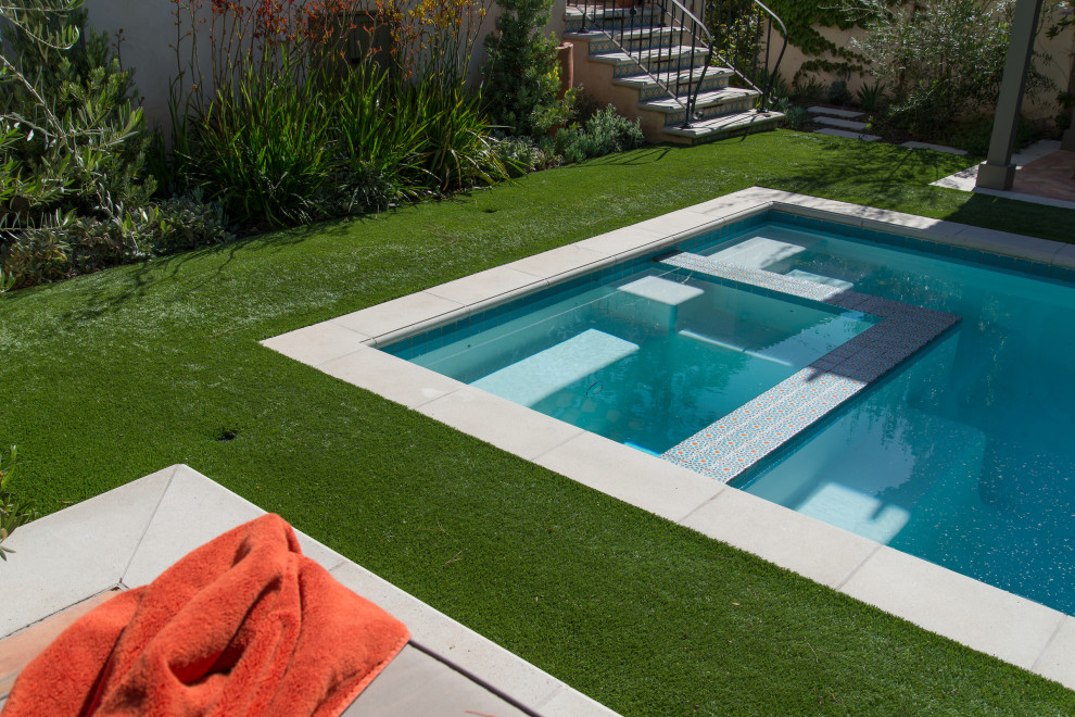 Photo of a mid-sized mediterranean backyard rectangular pool in Los Angeles.