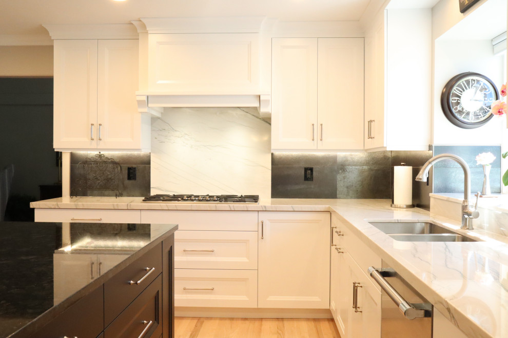 Inspiration for a mid-sized transitional light wood floor eat-in kitchen remodel in Salt Lake City with a double-bowl sink, recessed-panel cabinets, white cabinets, marble countertops, white backsplash, marble backsplash, stainless steel appliances, an island and white countertops
