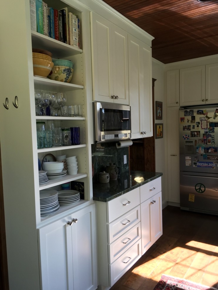 Example of a transitional u-shaped dark wood floor kitchen design in Boston with an undermount sink, shaker cabinets, white cabinets, granite countertops and stainless steel appliances