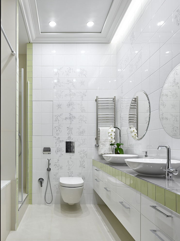 Design ideas for a contemporary master bathroom in Moscow with flat-panel cabinets, white cabinets, an alcove tub, an alcove shower, white tile, a vessel sink, white floor, grey benchtops, tile benchtops, a wall-mount toilet, white walls and a hinged shower door.