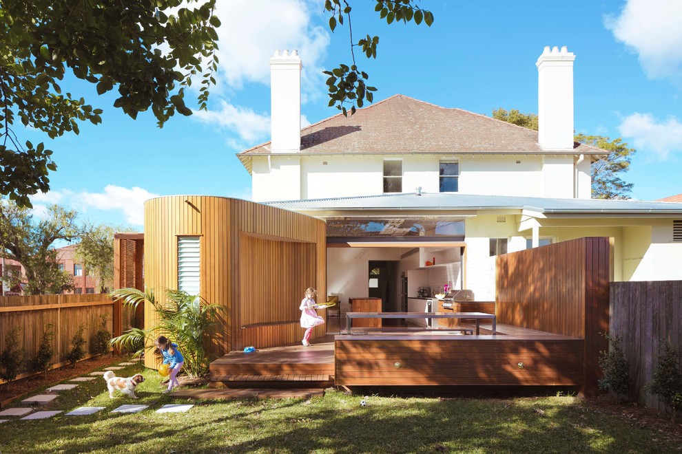 This is an example of a contemporary backyard partial sun garden in Sydney.