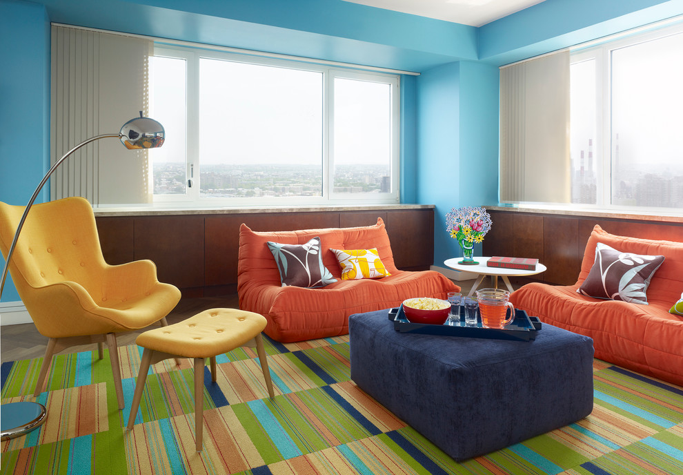 Example of a 1960s living room design in Denver with blue walls